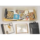 A box of assorted items including a silver charm bracelet, military badges etc.