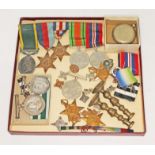 Assorted medals comprising a WWII group of five including a George VI Efficiency medal awarded to