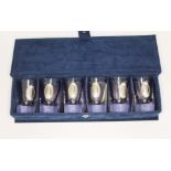 A cased set of six glass shot glasses, each with applied Argentinian silver plaque.