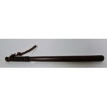 A wooden truncheon, 59.5cm long Chip to end of handle