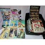 A box of adult magazines and booklets