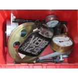 A box of assorted items including a BSA Bantam registration plate, various gauges, a brass wheel
