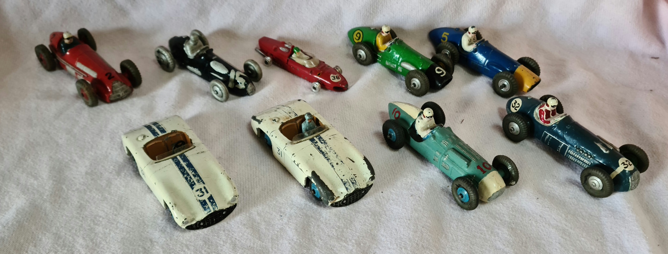 Dinky Toys, A group of 9 play worn racing cars to include 230 Talbot Lago, 235 H.W.M, 234 Ferrari,