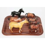 A group of Beswick and Royal Doulton horses, small and medium sizes.