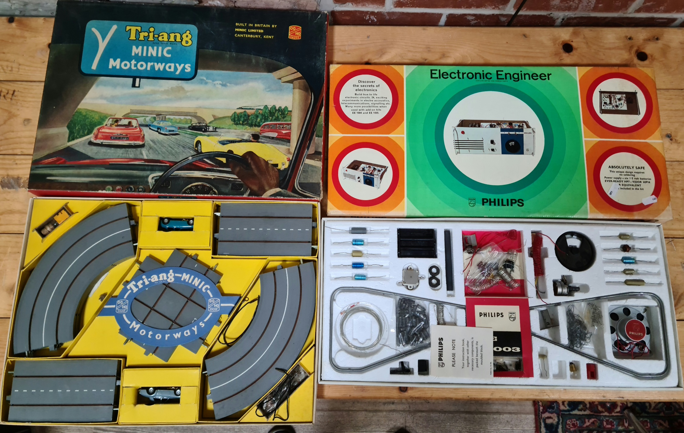 A Tri-ang Minic Motorways 00/H0 gauge set and a vintage Phillips Electronic Engineer set