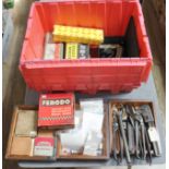 A box of assorted vehicle spares and tools.