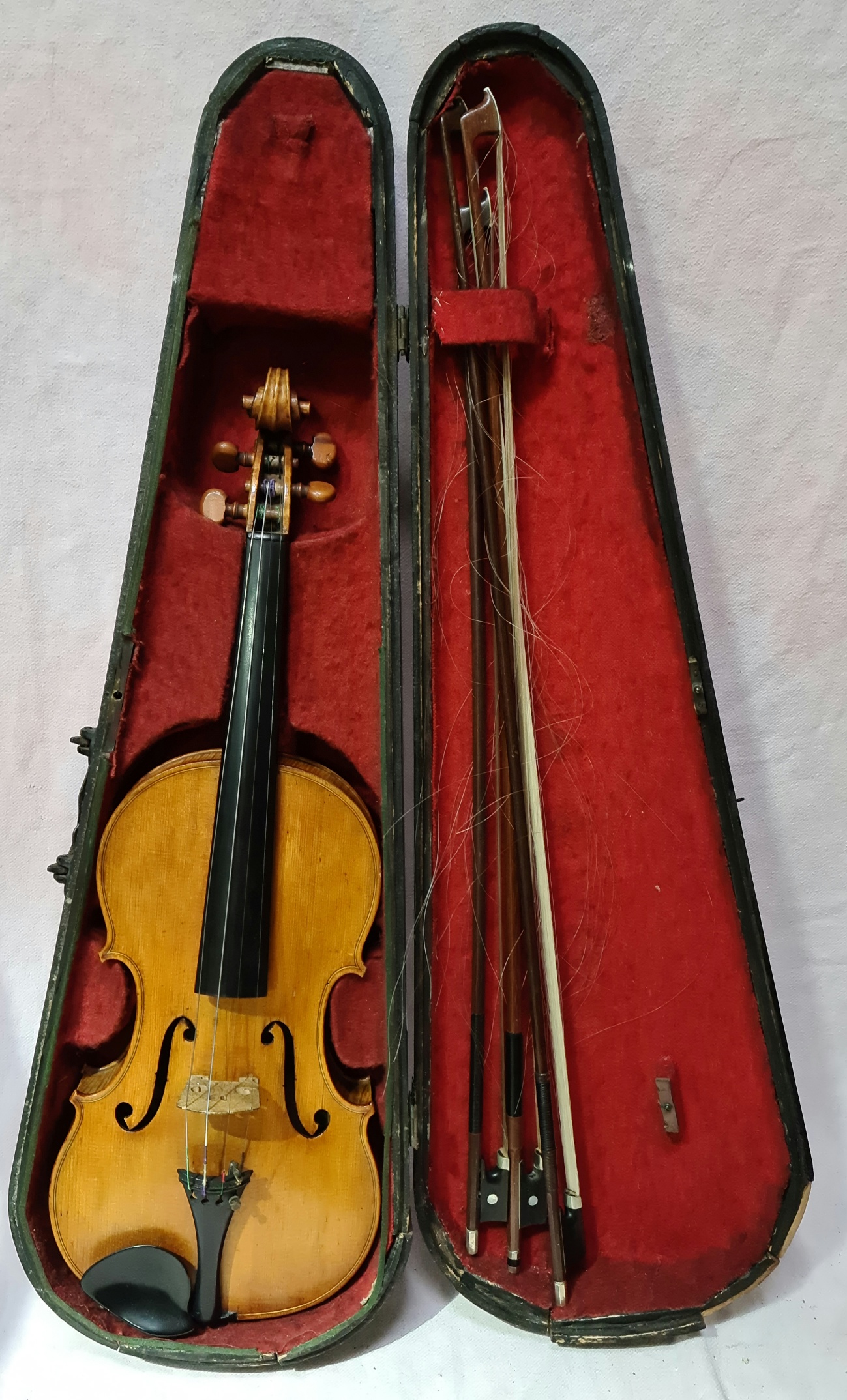 A late 19th century violin, one back, length 356mm, bearing label 'Joseph Guarnerius 17', with three