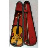 A late 19th century violin, one back, length 356mm, bearing label 'Joseph Guarnerius 17', with three