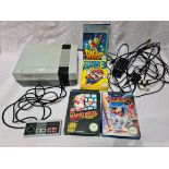 A Nintendo Entertainment System (NES) with controller and games including Super Mario Bros and Super