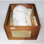 A plaster death mask "L'Inconnue De La Seine" (Lady of the Siene), housed in a Victoria & Albert
