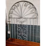 A wrought iron arched gate 98cm x 224cm.