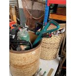 A tub of mixed garden tools including strimmer, sprayer, hose, and a tub of film posters