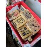 A box of crafting wooden and rubber stamps.