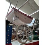 A Silver Cross childs pram, pink and cream