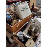 Two drawers of misc. including ship's lamps, clocks, an enamel bread bin, metal wear, a regimental