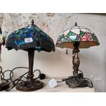 Two Tiffany style table lamps, one glass shade and one plastic shade