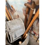 A galvanised watering can, a galvanised mop bucket and a selection of garden tools, spade, fork,