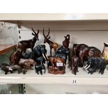 Selection of carved wood animals mainly elephants