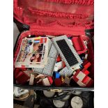 A vintage case containing mostly lego and some vintage toys.