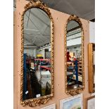 A pair of gilt framed mirrors, height 104cm.