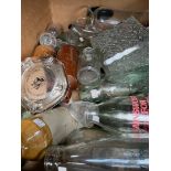 A box of vintage glass bottles, stoneware, earthenware, etc.