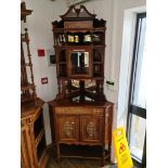 A late Victorian inlaid rosewood mirror back corner cabinet with plaque dated 1892.