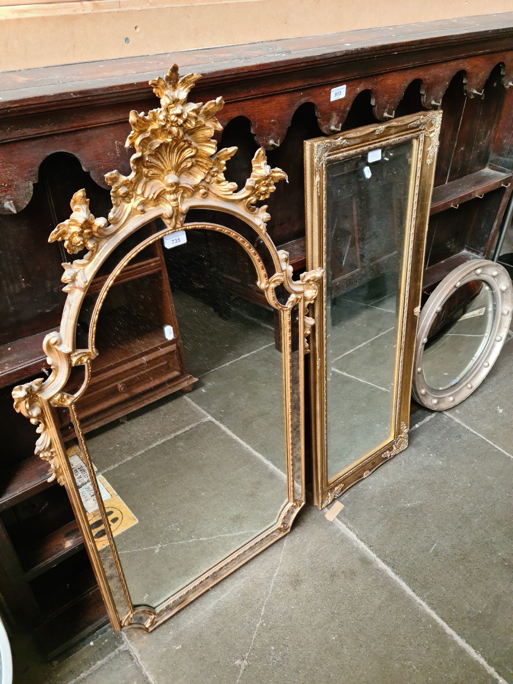 A modern Venetian style gilt framed mirror, 120cm x 64cm and another gilt framed mirror.