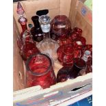 A box of glassware to include cranberry glass, decanter, etc.