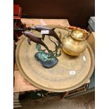 Eastern brass circular tray, a brass kettle and an Oriental dolphin ornament.