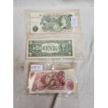 Three banknotes, one pound, ten shillings and a dollar.