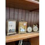 Two brass and glass carriage clocks to include a German Schatz and 2 small alarm clocks.