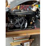 A Singer electric sewing machine with pedal
