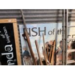 A glass shop sign in wooden frame "Brenda of Bispham" and a mural "Fish of the sea"
