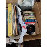 A bag of LPs and a box of 45s.