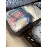 A vintage suitcase containing quantity of vintage clothing including furs and another vintage
