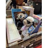 A box of assorted boxed Meerkats and Dolls