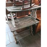 A Victorian cast iron garden table and a cast aluminium and wooden garden bench.