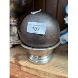 An antique cast iron cannon ball.