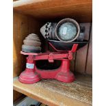 Kitchen scales and weights and an old carriage lamp.