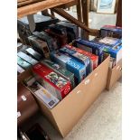 Four boxes of jigsaws, transport related.