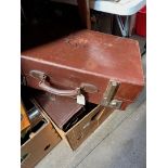 An expandable leather suitcase, 3 vintage suitcases and 2 leather briefcases.