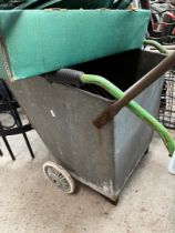 A galvanised cart with grill.