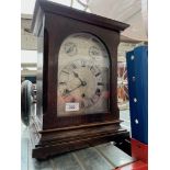 An early 20th century German chiming clock, with pendulum and keys.