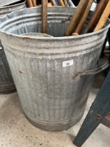A galvanised dust bin