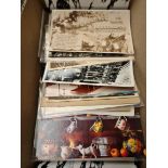 A box of vintage postcards and a file of vintage theatre programs