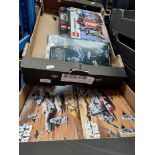 Two boxes of Lego Star Wars sets.