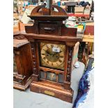 A walnut mantle clock, height 58cm.