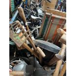 Quantity of garden tools to include a fork, shovel, galvanised watering can with rose, pick axe,