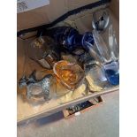 A box of mixed glassware including glass octopus, a blue etched vase, glass tumblers with metal