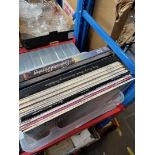 A box of assorted LPs.